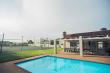 Swimming pool & tennis court - 20 Cayman Beach, self catering Gordons Bay