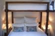 Cottage second bedroom with queen-size bed and single bed