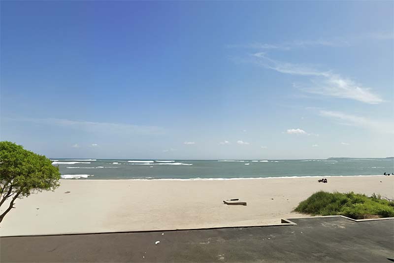 Beach in front of flats