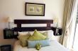 2nd bedroom with double bed and own balcony with mountain views
