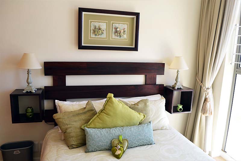 2nd bedroom with double bed and own balcony with mountain views