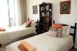 3rd bedroom 2x single beds and own balcony with mountain views