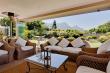 Terrace with glass foldaway doors open on to front garden