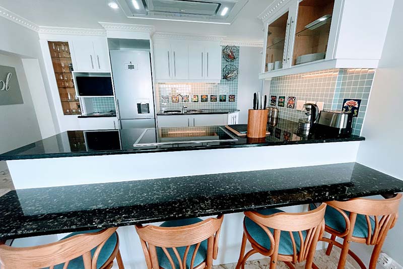 Pearl granite breakfast bar and kitchen