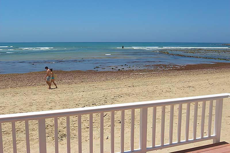 Step onto the beach from the deck