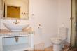 En-suite bathroom with shower for main bedroom.