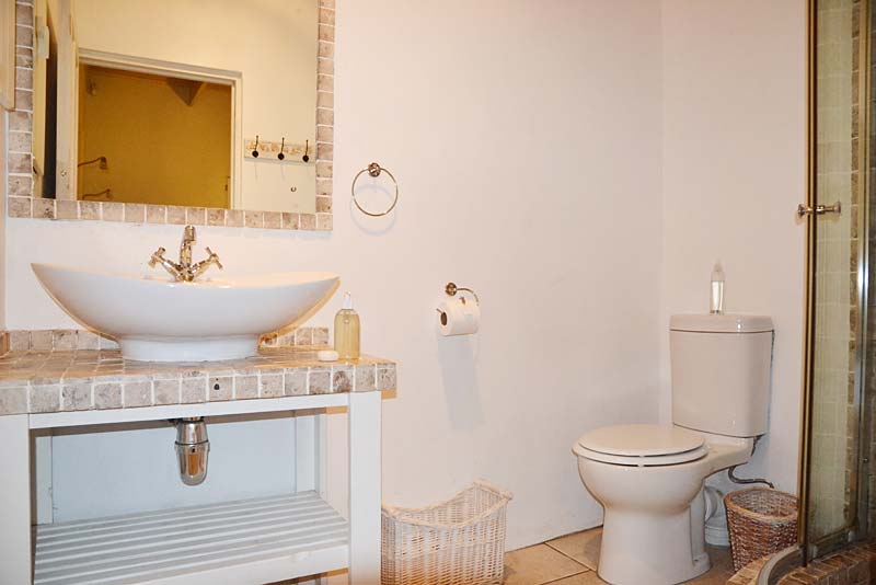 En-suite bathroom with shower for main bedroom.
