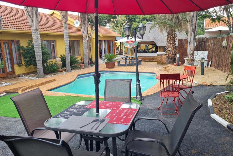 Patio overlooking the inviting pool!