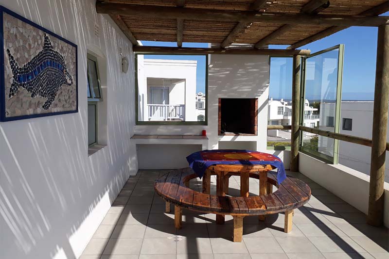 Seagull under cover table and braai area