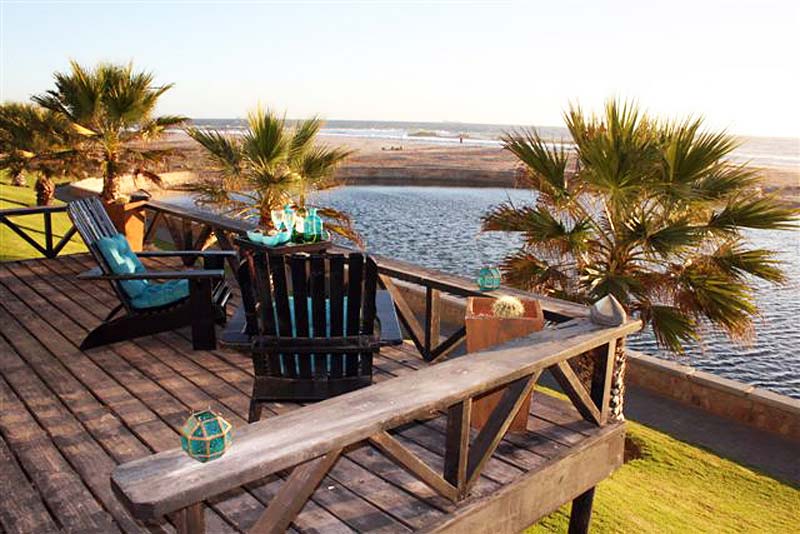 View on water-feature, sea and beach from the deck