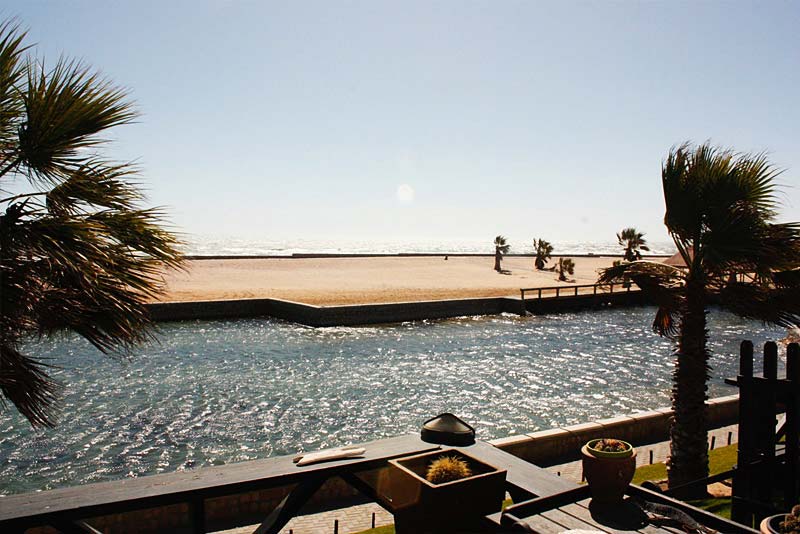 View on water-feature, sea and beach from the deck