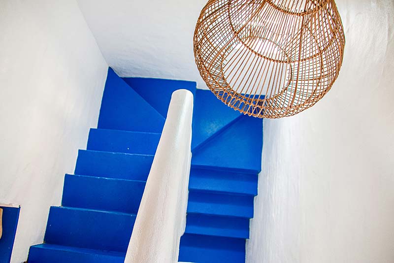 Thatch apartment upstalrs to the bedroom and bathroom