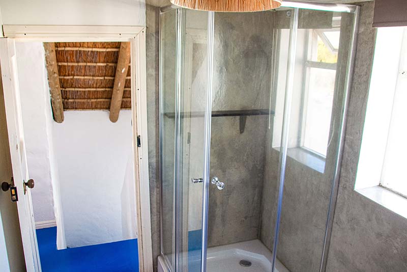 The Thatch apartment bathroom with shower
