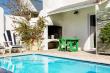 The Detach apartment front door, patio and braai area
