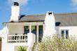 The Top loft apartment patio.  Open glass doors to braai