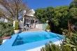 Private pool on enclosed wooden deck in garden
