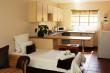 Room 4 extra bed and kitchen