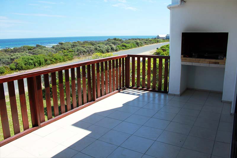 Sheltered braai patio with 180 degree views of sea.