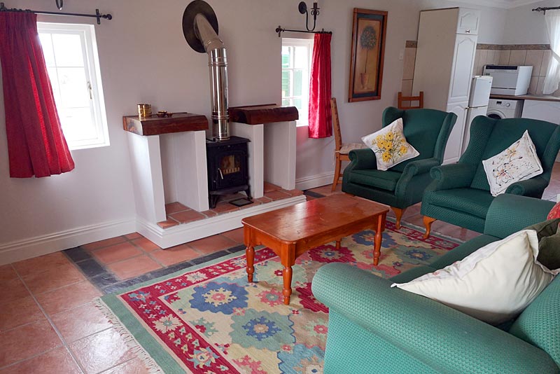 Comfy chairs around the fireplace