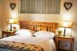 the queen size bed with quality linen and handmade quilt