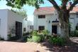 Pin Oak and Wisteria suites to the left of main house