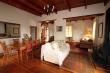 Dining room open plan with formal lounge and kitchen. Fireplace.
