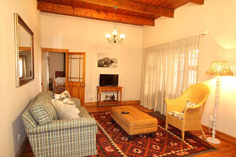 TV lounge with french doors to stoep with braai.