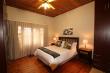 Main bedroom downstairs with en-suite (double showers & basins), spa bath & separate toilet.