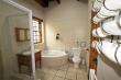 Downstairs full bathroom - shared by two bedrooms. (1 being en-suite)2 door access.