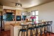 Kitchen with breakfast bar & stools,oven, stove, small basin, etc.