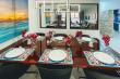 Dining area for 6 people with big mirrors to reflect ocean.