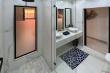 Ensuite bathroom with big shower and double vanities.