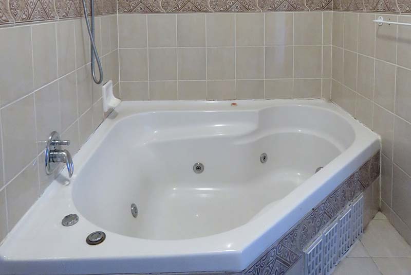 Bathroom 1 with spa bath ensuite to Bedroom 1 top section