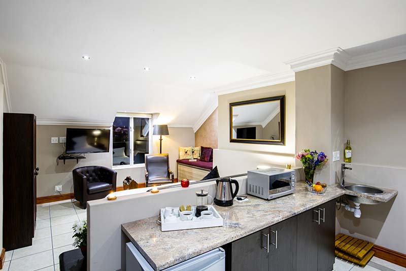 The kitchenette is equipped with necessary utilities