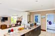 Family unit with kitchenette, lounge, TV, balcony and braai.