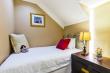 Small bedroom with two three-quarter beds