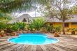 rock splash pool encased with cycads