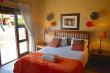 one of the bedrooms with queen bed