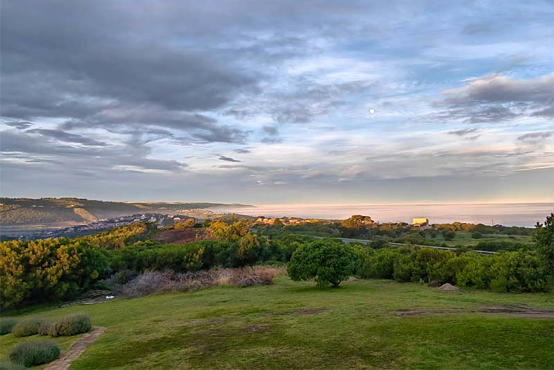 View from The Nightingale into sunset over the ocean