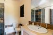 Ensuite bathroom with shower, toilet & washbasin