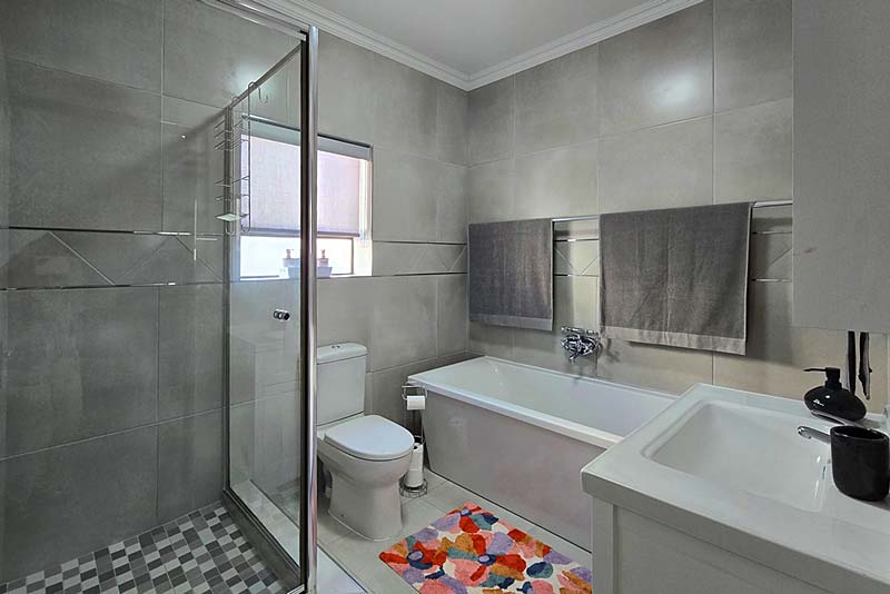 Stylish bathroom with shower and freestanding bath