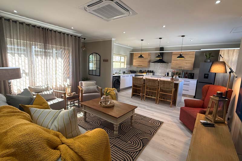 The Living area looking onto the Kitchen during the day