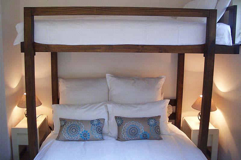 Cottage second bedroom with queen-size bed and single bed