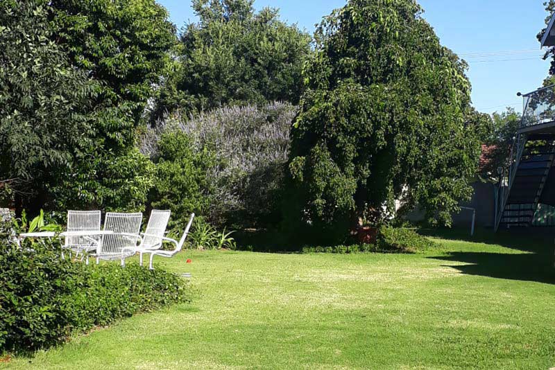 North garden seating - Bedrock Self Catering in Bloemfontein