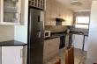 Kitchen with dishwasher and washing machine - De Branders Apartment 45 self catering Hartenbos