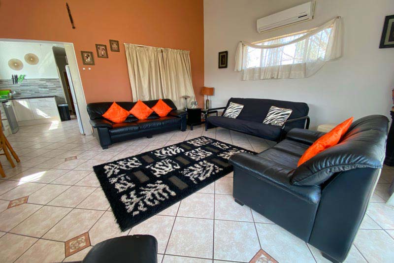 Large air conditioned lounge with sleeper couch and DSTV 
