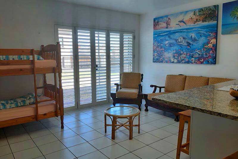 Living area, note safety shutters at sliding door