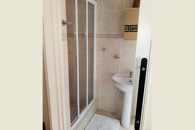 Bathroom with shower, basin and toilet