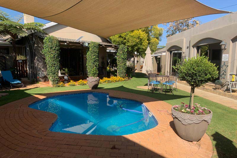 Enjoy the very private heated pool in our beautiful garden