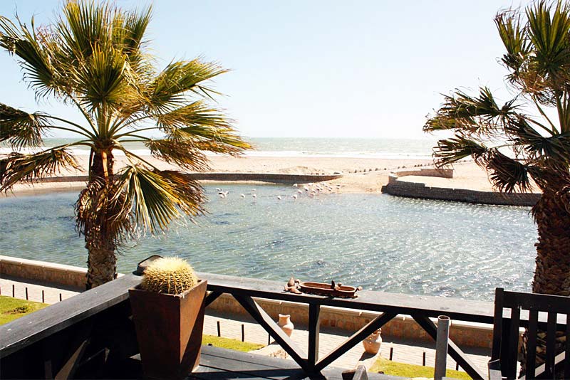 View on water-feature, sea and beach from the deck